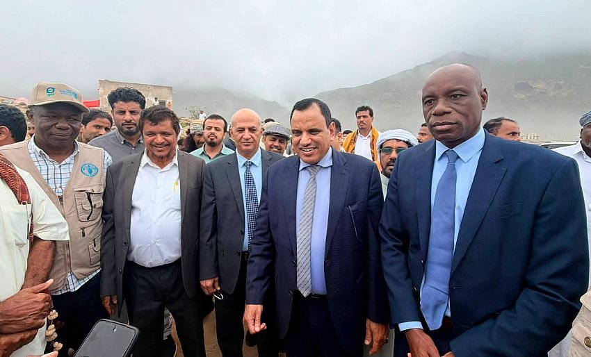 Yemeni ministers and the FAO representative in Yemen stand with local officials and fishermen at the inauguration of a fish landing centre in Hauf district, al-Mahrah governorate