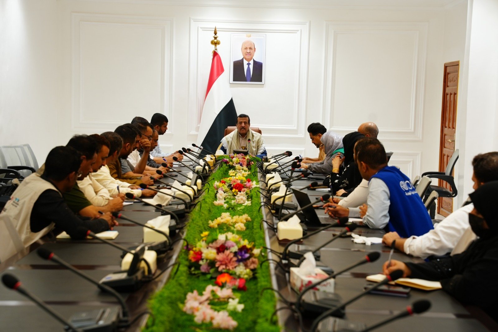 Officials seated around a conference table in Marib during the meeting that approved the emergency measles response plan