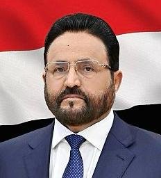 Sultan al-Arada, Marib governor and member of Yemen's Presidential Leadership Council, pictured in front of the Yemeni flag