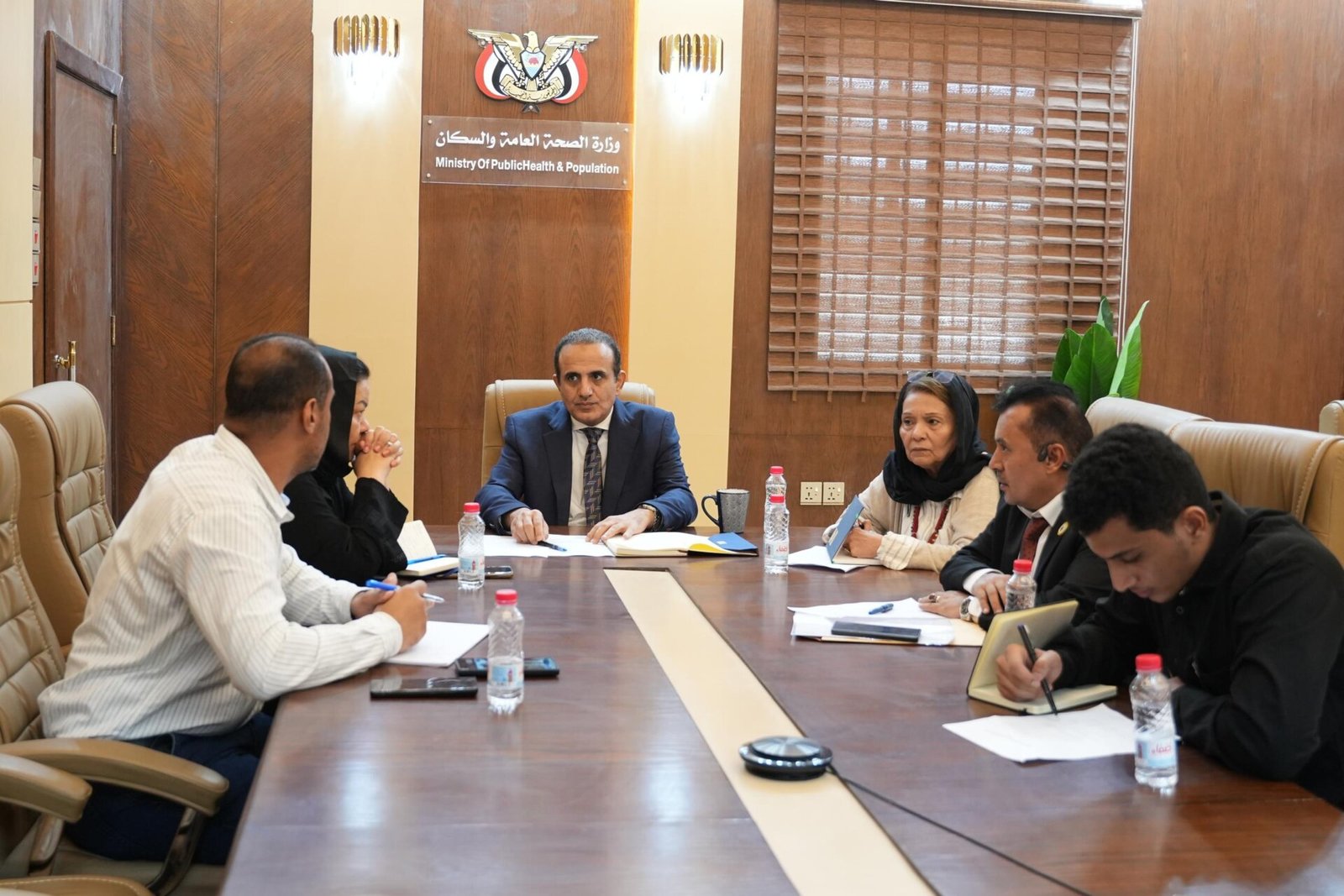 Yemen’s Minister of Public Health and Population Dr. Qasim Buhaib chairs a video conference with UNOPS officials at the ministry in Aden
