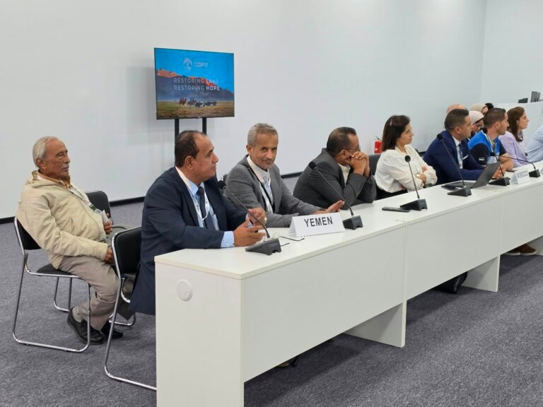 Members of Yemen's delegation seated behind a Yemen nameplate at the UNCCD COP17 desertification conference in Ulaanbaatar, Mongolia