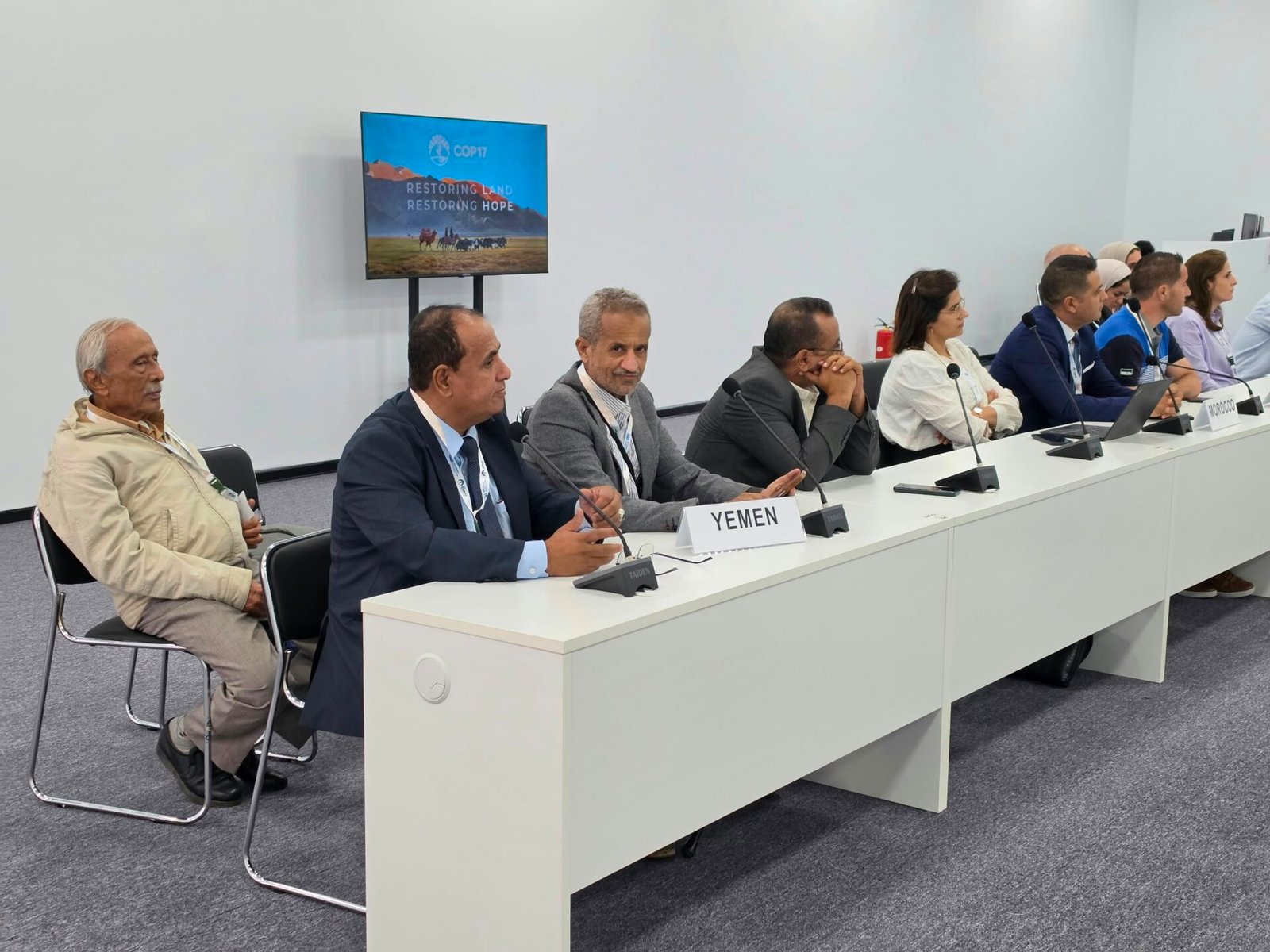 Members of Yemen's delegation seated behind a Yemen nameplate at the UNCCD COP17 desertification conference in Ulaanbaatar, Mongolia
