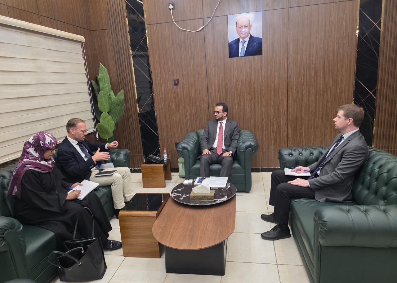 Yemen's Minister of Civil Service and Insurance Salem al-Awlaqi meets an economic adviser from the UN Special Envoy's office in Aden