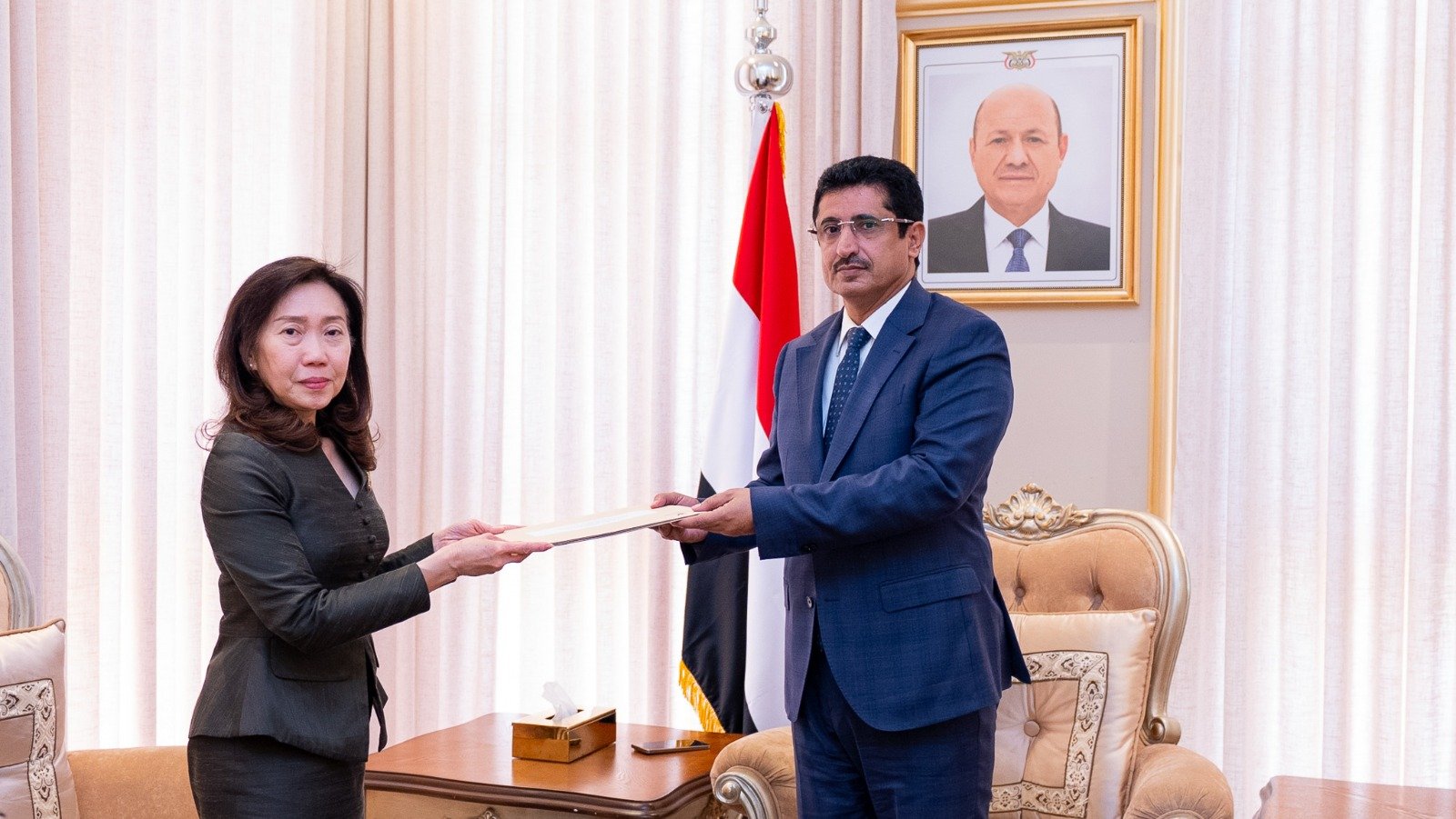 Thailand's non-resident ambassador Warunee Ban Krajang hands a copy of her credentials to Yemeni Deputy Foreign Minister Dr. Mansour Bagash