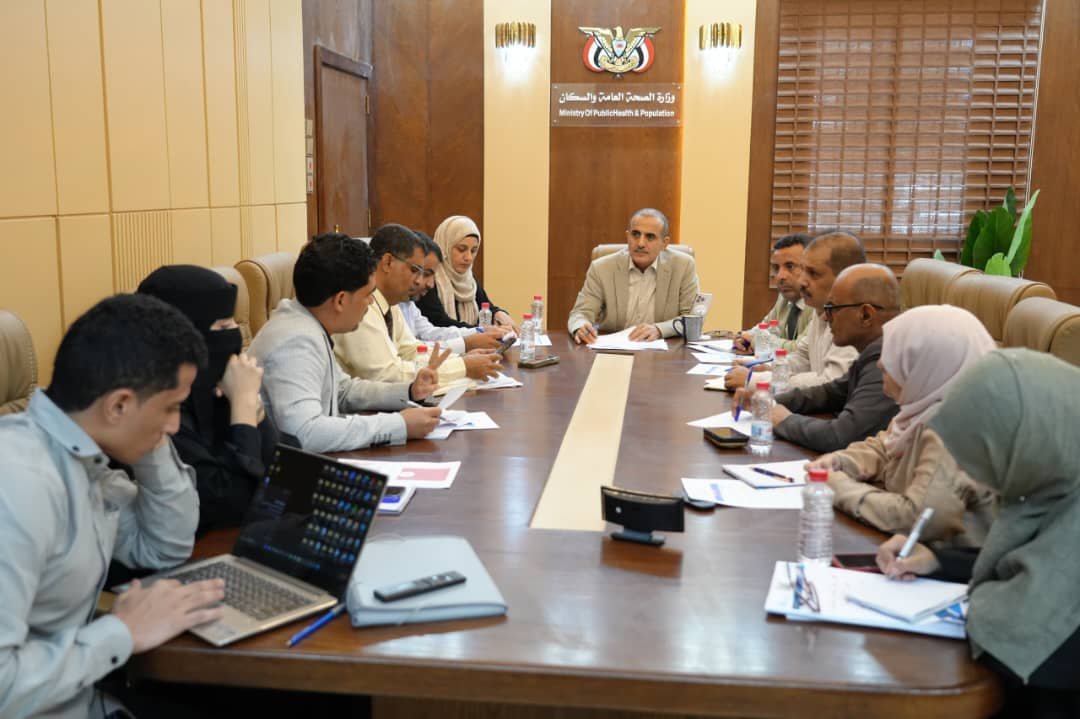 Yemeni health officials seated around a conference table during a Health Events Committee meeting in Aden