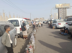 Rows of empty gas cylinders line a street in Aden as residents wait for a delivery of cooking gas