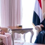 Yemeni Foreign Minister Afrah al-Zouba meets Abda Sharif, the United Kingdom ambassador to Yemen, in a reception room with Yemeni flags in Riyadh