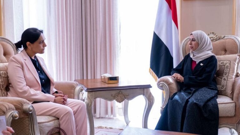 Yemeni Foreign Minister Afrah al-Zouba meets Abda Sharif, the United Kingdom ambassador to Yemen, in a reception room with Yemeni flags in Riyadh