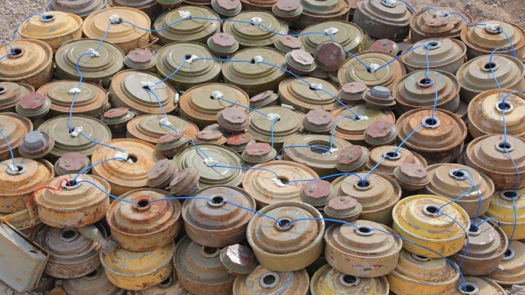 Rows of landmines and explosive devices laid out after clearance in Yemen