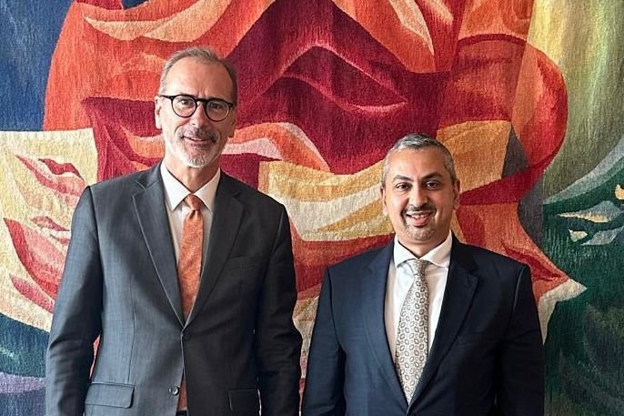 Yemen's ambassador to Germany standing with a German foreign ministry official in Berlin