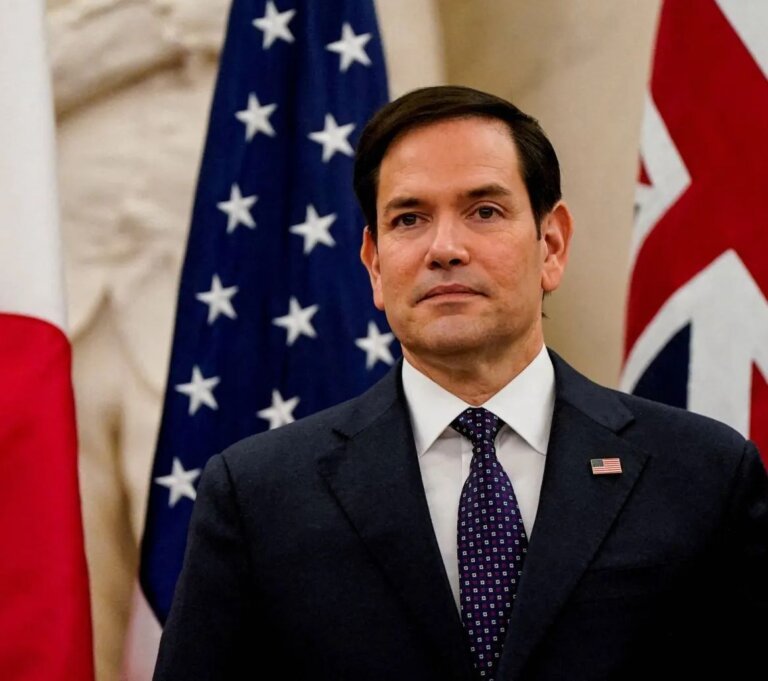 US Secretary of State Marco Rubio speaking in front of the United States flag