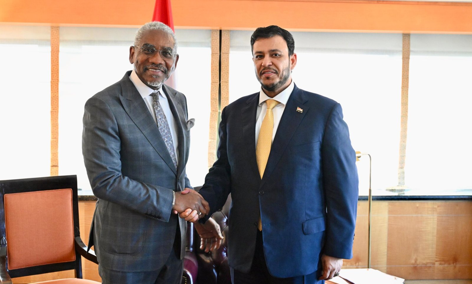 Yemeni Presidential Leadership Council member Abdullah al-Alimi Bawazir shaking hands with US Representative Gregory Meeks