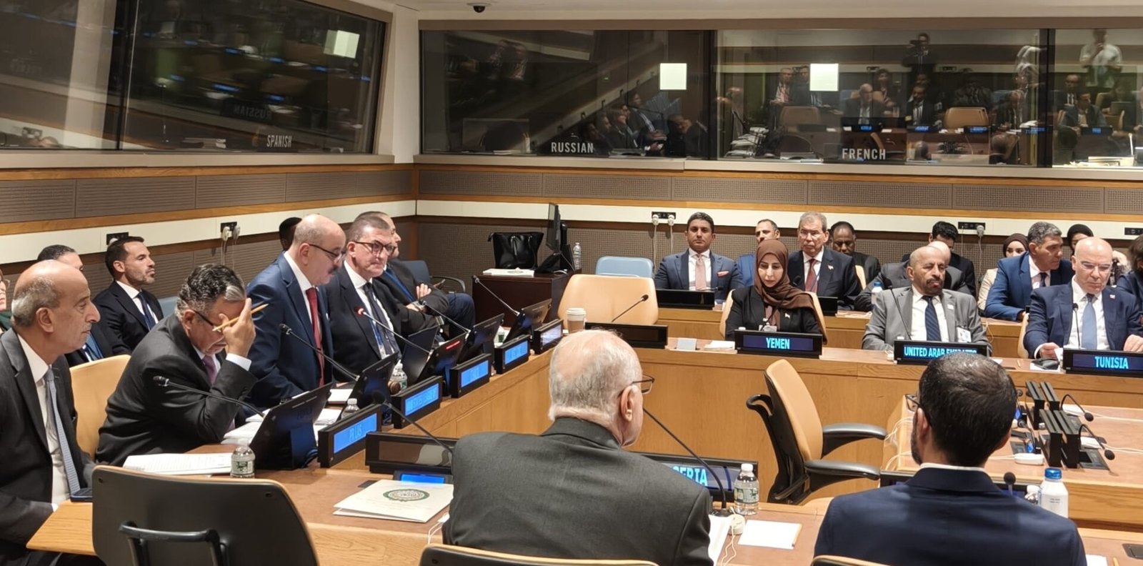 Foreign ministers seated at a horseshoe table with country nameplates during an Arab League Council session at United Nations headquarters in New York