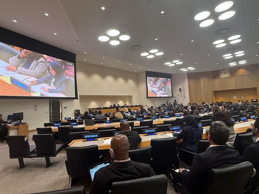 Delegates seated at desks in a United Nations conference room during a ministerial meeting in New York