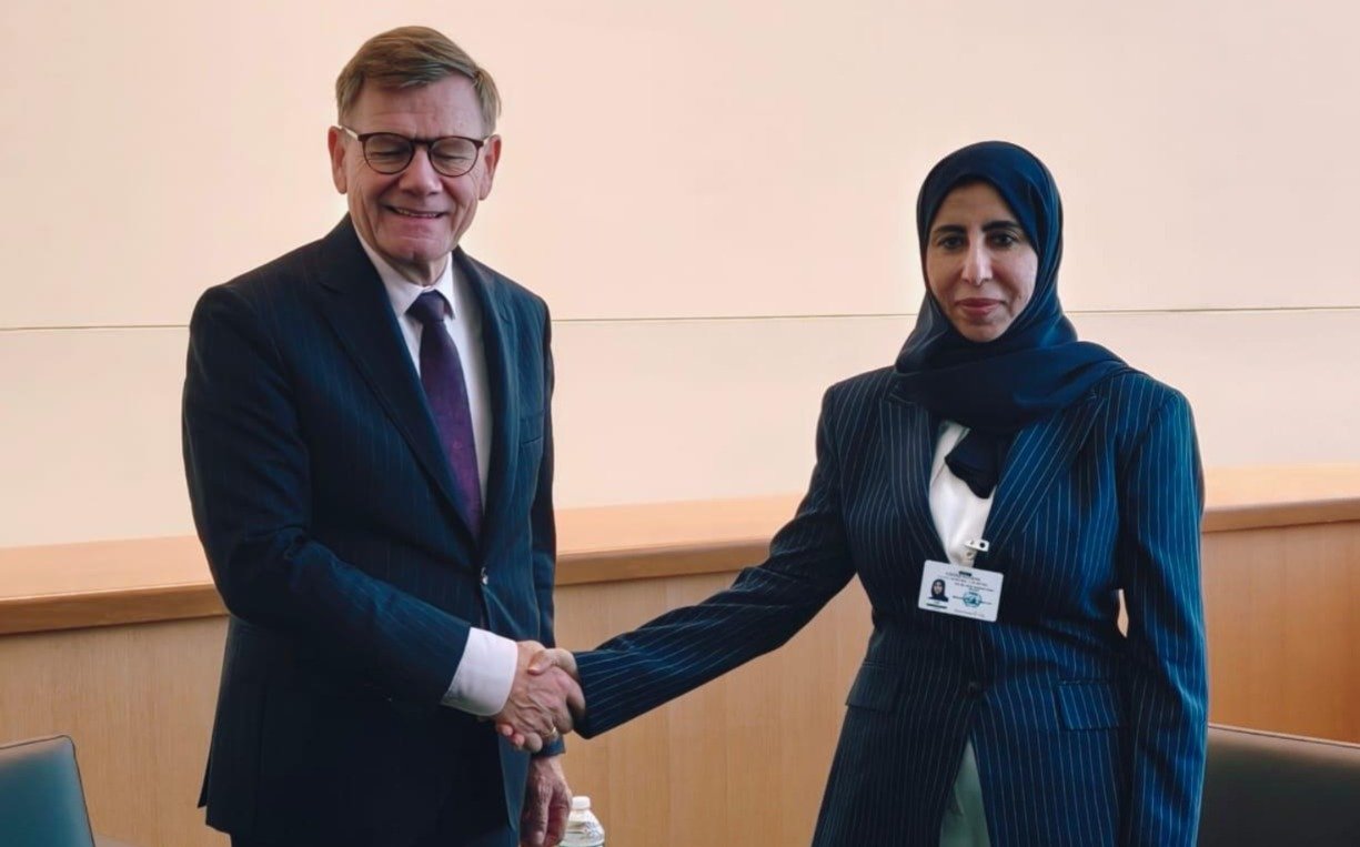 Yemeni Foreign Minister Afrah al-Zouba shakes hands with German Foreign Minister Johann Wadephul on the sidelines of the UN General Assembly in New York