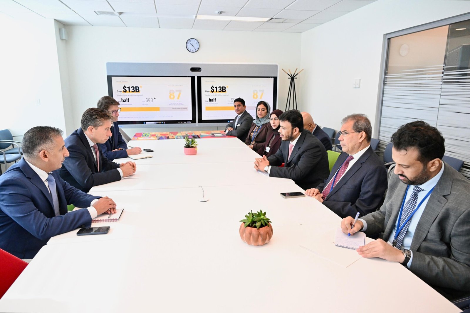 Yemeni and UN officials seated around a conference table during a meeting in New York