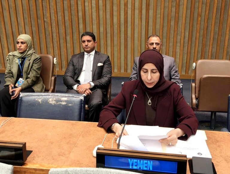 Yemeni Foreign Minister Afrah al-Zouba speaking behind a Yemen nameplate at a United Nations meeting in New York