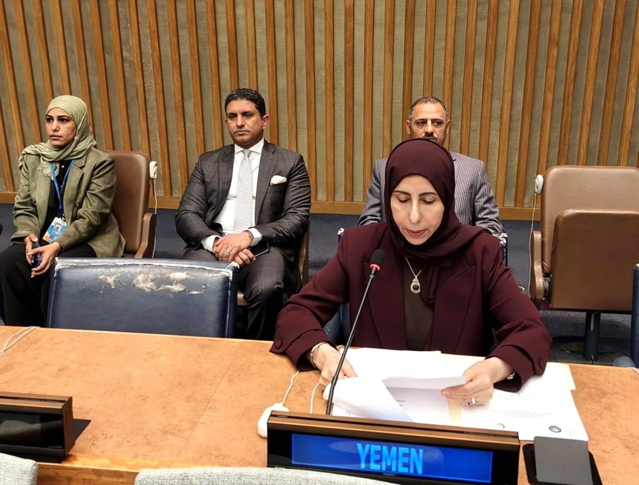 Yemeni Foreign Minister Afrah al-Zouba speaking behind a Yemen nameplate at a United Nations meeting in New York