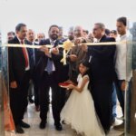 Officials cut a ribbon at the opening of the College of Information Technology and Computer Science building at the University of Saba Region in Marib