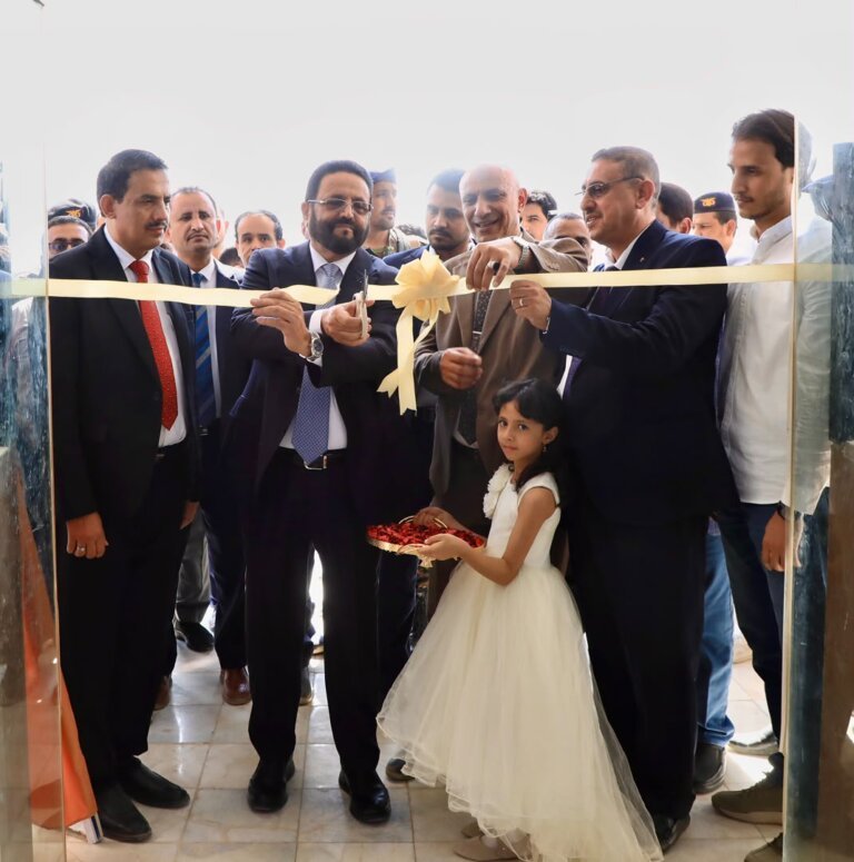 Officials cut a ribbon at the opening of the College of Information Technology and Computer Science building at the University of Saba Region in Marib