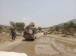 A truck carrying displaced families on a road in western Yemen