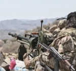 Yemeni government fighters man a machine gun position on a mountain front line in al-Dhalea province