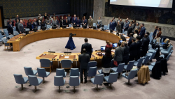Delegates stand in the United Nations Security Council chamber during a session on Yemen