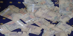 Yemeni rial banknotes spread across a surface
