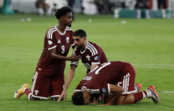 Qatar players celebrate on the pitch after scoring against Yemen at the Arabian Gulf Cup in Jeddah