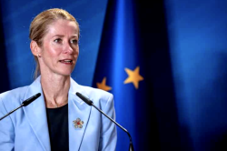 EU High Representative Kaja Kallas speaks at a podium in front of a European Union flag