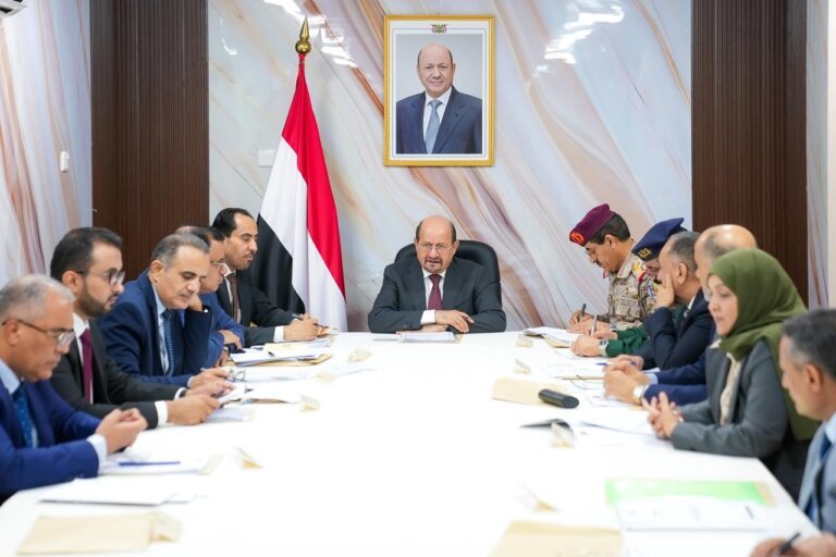 Yemeni ministers seated around a table during a Council of Ministers session in Aden