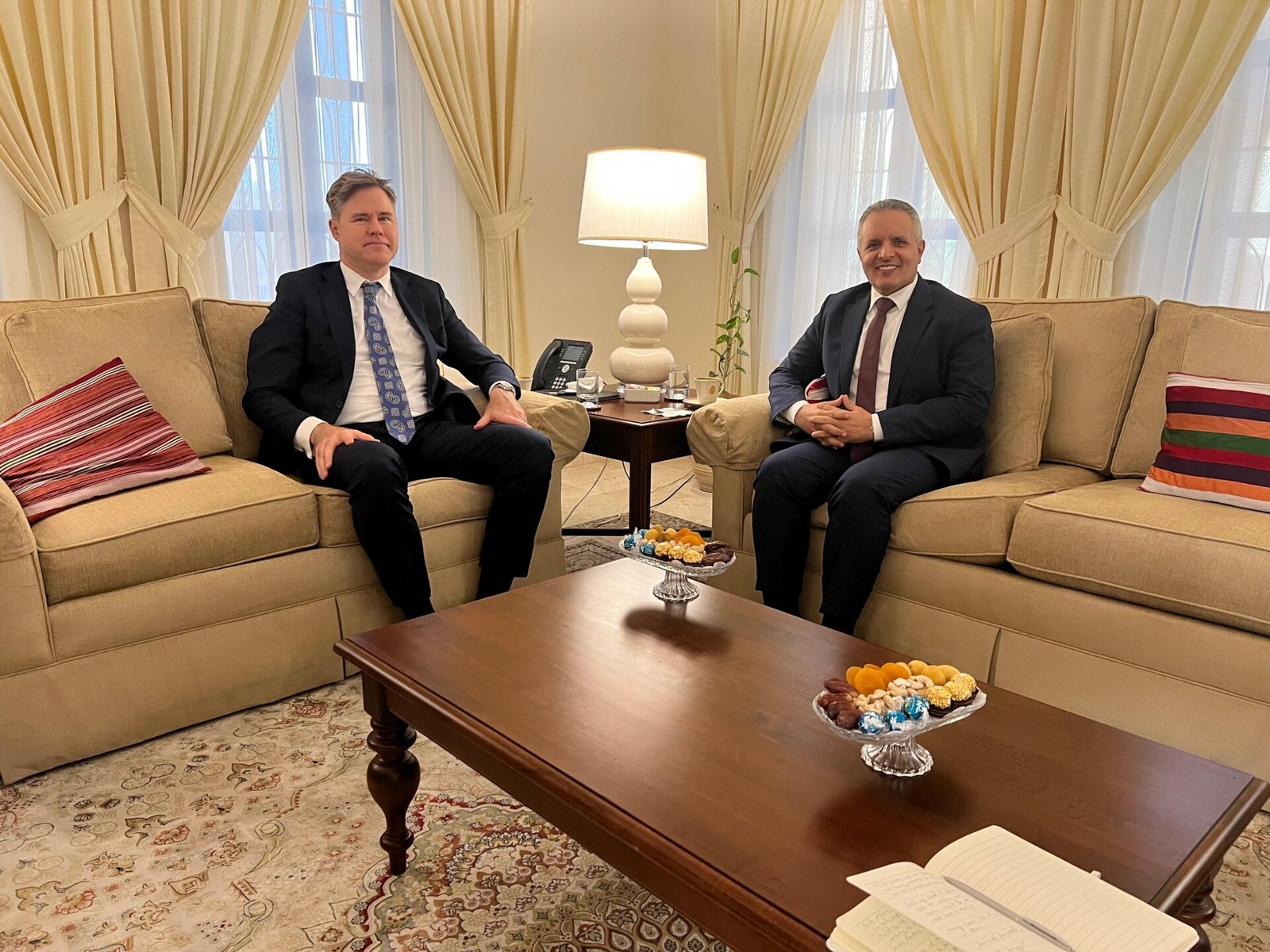Yemen's social affairs minister and the U.S. charge d'affaires for Yemen seated during talks in Riyadh