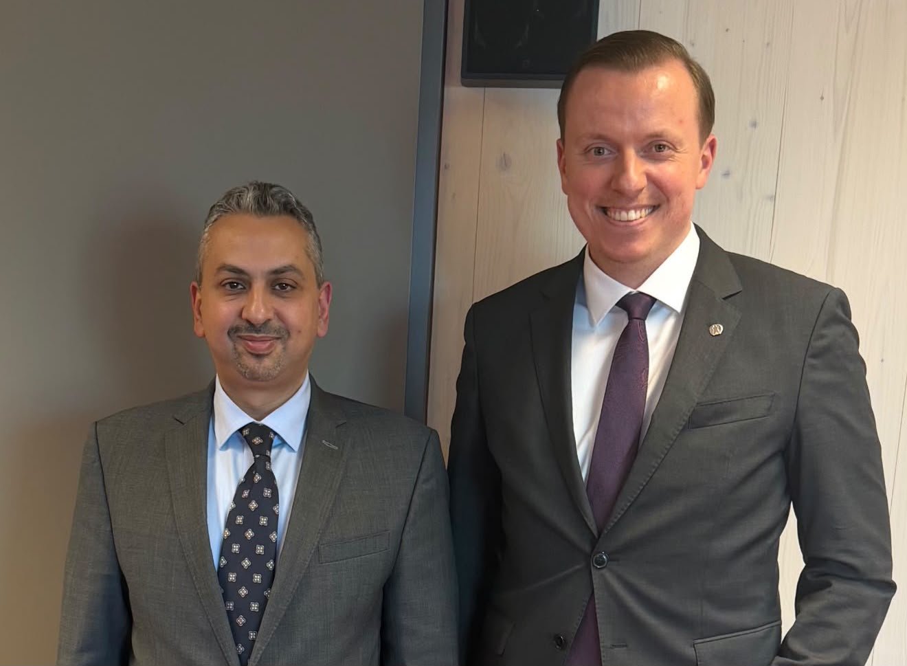 Yemen's ambassador to Germany Louay al-Eryani standing with German Bundestag member Adis Ahmetovic after their meeting in Berlin