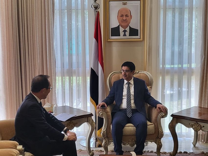 Two officials seated in armchairs during a bilateral meeting in a Yemeni government reception room