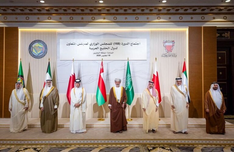 Gulf Cooperation Council foreign ministers stand before member state flags at the 168th Ministerial Council session in Manama