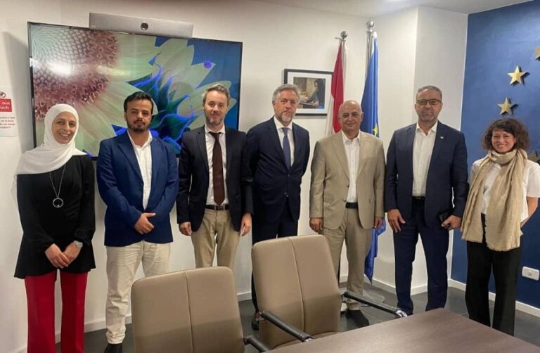 Yemen's water and environment minister Tawfiq al-Sharjabi stands with EU ambassador Patrick Simonnet and officials at the EU delegation offices in Amman, Jordan.