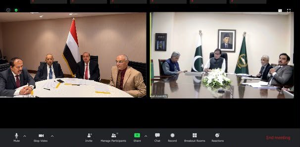 Split-screen video call showing a Yemeni delegation seated beside the Yemeni flag and a Pakistani delegation beside the Pakistani flag during a virtual meeting of the two parliament speakers