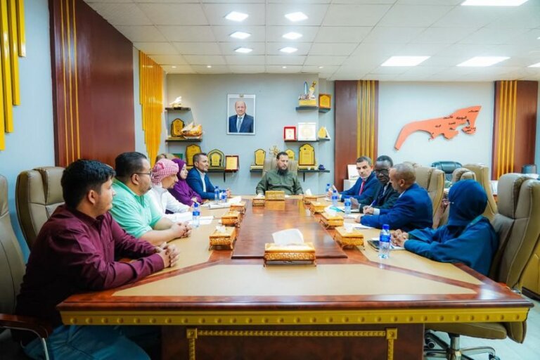 Officials seated around a conference table during a meeting between the Aden governorate and UNICEF in Aden