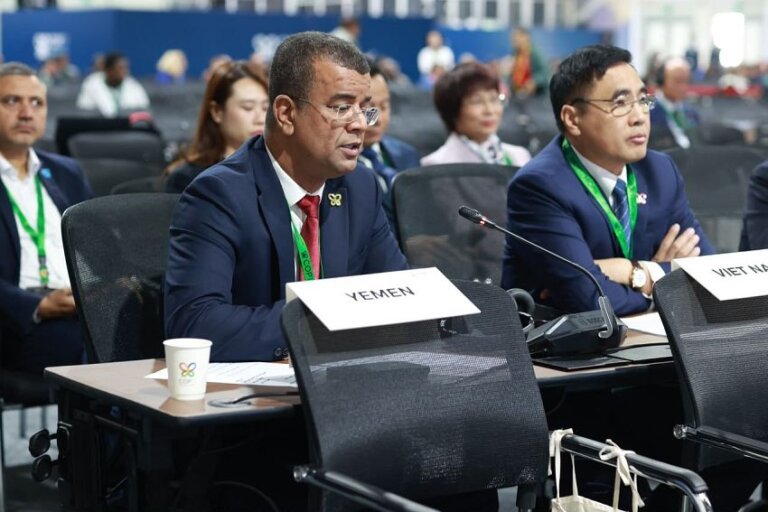 Delegates seated behind a Yemen name placard at a plenary session of the UN biodiversity conference in Yerevan