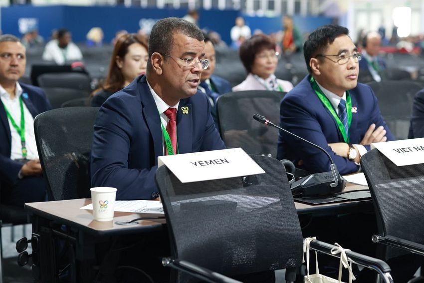 Delegates seated behind a Yemen name placard at a plenary session of the UN biodiversity conference in Yerevan