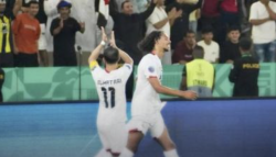 Yemen players in white shirts celebrate a goal in front of spectators during their Gulf Cup match against Bahrain in Jeddah