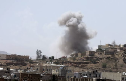 Smoke rises over a village after an airstrike in Yemen