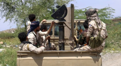 Yemeni government soldiers on a pickup truck mounted with a heavy weapon on a front line in Taiz governorate