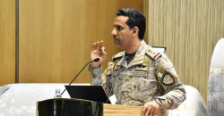 Coalition spokesman Maj. Gen. Turki al-Maliki speaks at a podium during a military briefing