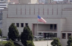 The United States diplomatic mission building in Saudi Arabia, flying the US flag, after the mission restricted staff use of three Saudi airports.