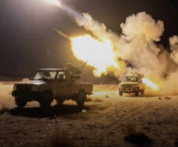 A military vehicle firing during fighting in Yemen