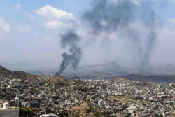 Smoke rises over buildings in Taiz, Yemen, after shelling on the city outskirts